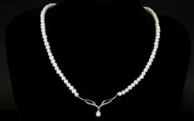 9ct Diamond Set Pearl Necklace Collar style necklace with central v-shaped station set with diamond