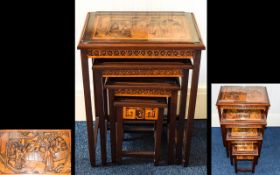 Chinese Hand Carved Nest Of Tables Four nesting tables,