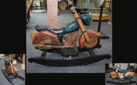 A Handcarved Wooden Motorcycle Rocking Toy Child's ride on rocking toy in the form of a vintage