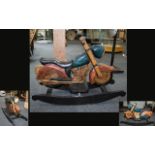 A Handcarved Wooden Motorcycle Rocking Toy Child's ride on rocking toy in the form of a vintage