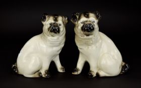 Antique Period - 19th Century Pair of Porcelain Pug Dog Figurines In Seated Positions.