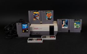 1985 Nintendo Entertainment System with controllers and five games- Terminator, Kung Fu, Punch Out,