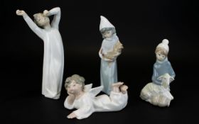 A Collection of Lladro Figures ( 4 ) Four In Total. Various Subjects and Sizes.