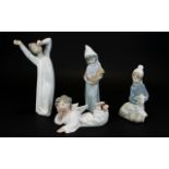 A Collection of Lladro Figures ( 4 ) Four In Total. Various Subjects and Sizes.