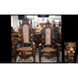 A Pair Of Large Ornately Carved Throne Chairs 20th century high backed chairs with heavily carved