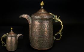 19th Century Middle Eastern Lidded Wine Ewer Copper body with brass mounts, profusely engraved,