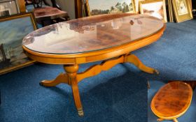 Solid Yew Wood Oval Coffee Table fitted with glass top.