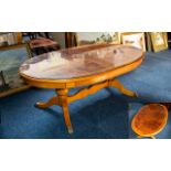 Solid Yew Wood Oval Coffee Table fitted with glass top.