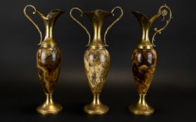 A Garniture Set Of Two Ewers And Vase Middle eastern style with central hard stone body with brass
