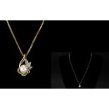 Ladies 9ct Gold - Pearl and Diamond Set Pendant Drop with Attached 9ct Gold Long Chain.