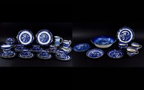 A Large Collection Of Willow Pattern Serve Ware Over forty items in total to include trivet, jug,