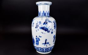 Antique Chinese Vase A large ovoid vase in traditional blue and white figurative design.