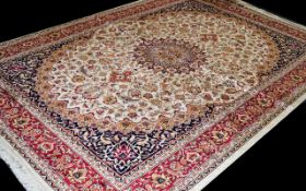 A Very Large Woven Silk Carpet Keshan rug with beige ground and traditional Middle Eastern floral