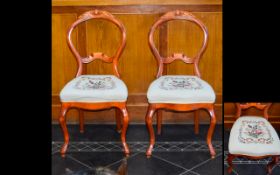 A Pair Of Scandinavian Balloon Back Chairs With decorative floral moulding to headrest and