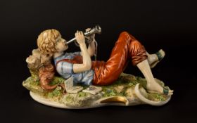 Lovely Capodimonte Boy With Trumpet - Sandro Maggioni of 9 inches long 5.5 inches high.