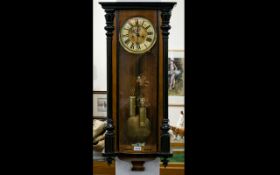 Walnut Cased Vienna Wall Clock, Cream Chapter Dial With Roman Numerals and subsidiary seconds,