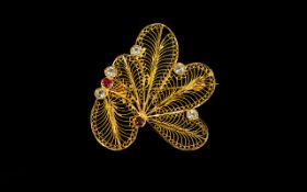 A Vintage Indian Brooch Unusual gold tone brooch of foliate design with reticulated wire work