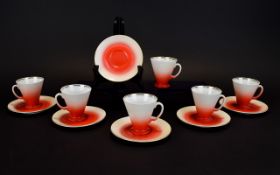 A Set of 6 Chinese Conical Shaped Coffee Cups and Saucers red graduated shading with gilt trim.