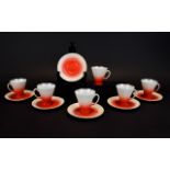 A Set of 6 Chinese Conical Shaped Coffee Cups and Saucers red graduated shading with gilt trim.