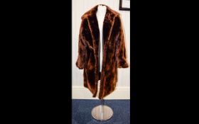 Beaver Lamb Three Quarter Length Coat, fully lined with slit pockets and hook eye fastening.