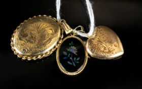 A Collection of Gold Pendants comprising a heart shaped locket an oval pendant and a black inset
