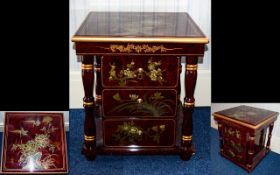 A Decorative Chinese Chest Of Drawers Of square form with turned pilaster detail and three central