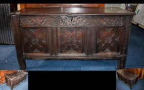 A Late 17th/Early 18th Century Oak Coffer Large coffer with carved panels to front and sides.