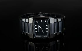 Bvlgari Designer Gents Wind Up Wristwatch with black polished dial and steel bracelet.