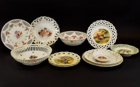 A Collection of Porcelain Ribbon Plates. Each plate depicting various decorative scenes to central