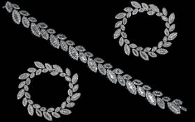 A Superb Quality and Impressive Well Matched 18ct White Gold - Diamond Set Bracelet.