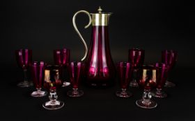 Ruby Red Glass Claret Jug with pewter lid. Together with 10 associated drinking glasses.