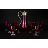 Ruby Red Glass Claret Jug with pewter lid. Together with 10 associated drinking glasses.