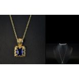 A Contemporary 9ct Gold Open worked Mounted Sapphire Set Pendant Drop with Attached 9ct Gold Chain.