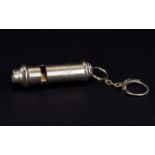 Police Whistle A small silver tone whistle with attached chain and key ring detail. Impressed