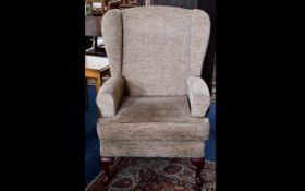 Winged Back Arm Chair, a high backed arm chair with splayed legs.