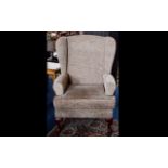 Winged Back Arm Chair, a high backed arm chair with splayed legs.