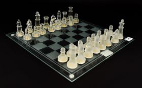 Modern Glass Chess Set Comprising of glass board and frosted and clear glass pieces.