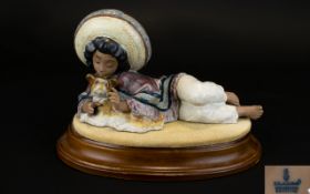 Lladro Gres Figure ' Julio ' Mexican Boy. Raised on Oval Shaped Wooden Plinth. Sculpture Jose Puche.