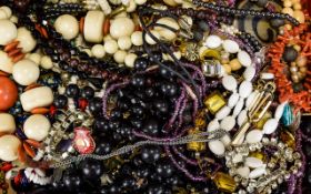 A Mixed Lot Of Costume Jewellery to include, several beads, white metal chains,