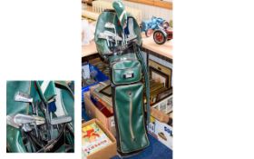 A Set Of Various Golf Clubs And Golf Bag