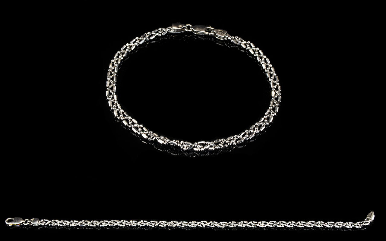 A 9ct White Gold Curb And Twist Bracelet