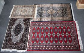 A Collection Of Four Indian Carpets Four