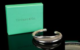 Tiffany & Co Sterling Silver Bangle. Marked Tiffany & Co. 925. Complete with Tiffany & Co Box.