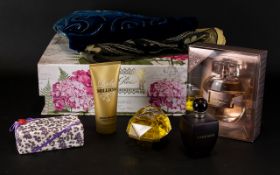 A Collection of Assorted Perfumes and Silk Scarves.