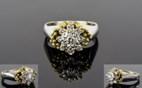 18ct Gold Set Diamond Cluster Ring. Flower head Setting, The Central Diamond Surrounded by a Further