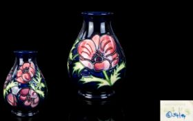 Moorcroft Modern Tube lined Bulbous Shaped Vase ' Anemone ' Design on Blue Ground.