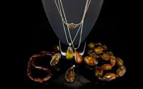 A Collection Of Silver And Synthetic Amber Jewellery Eight items in total to include beaded