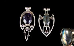 Two Large Silver And Stone Set Handmade Pendants Each of stylised Arts and Crafts form.