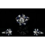 18ct White Gold Diamond and Sapphire Dress Ring, In a Flower head Design Setting.