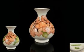 Moorcroft Tube lined - Globular Shaped Vase ' Coral Hibiscus ' Design on Cream Ground.